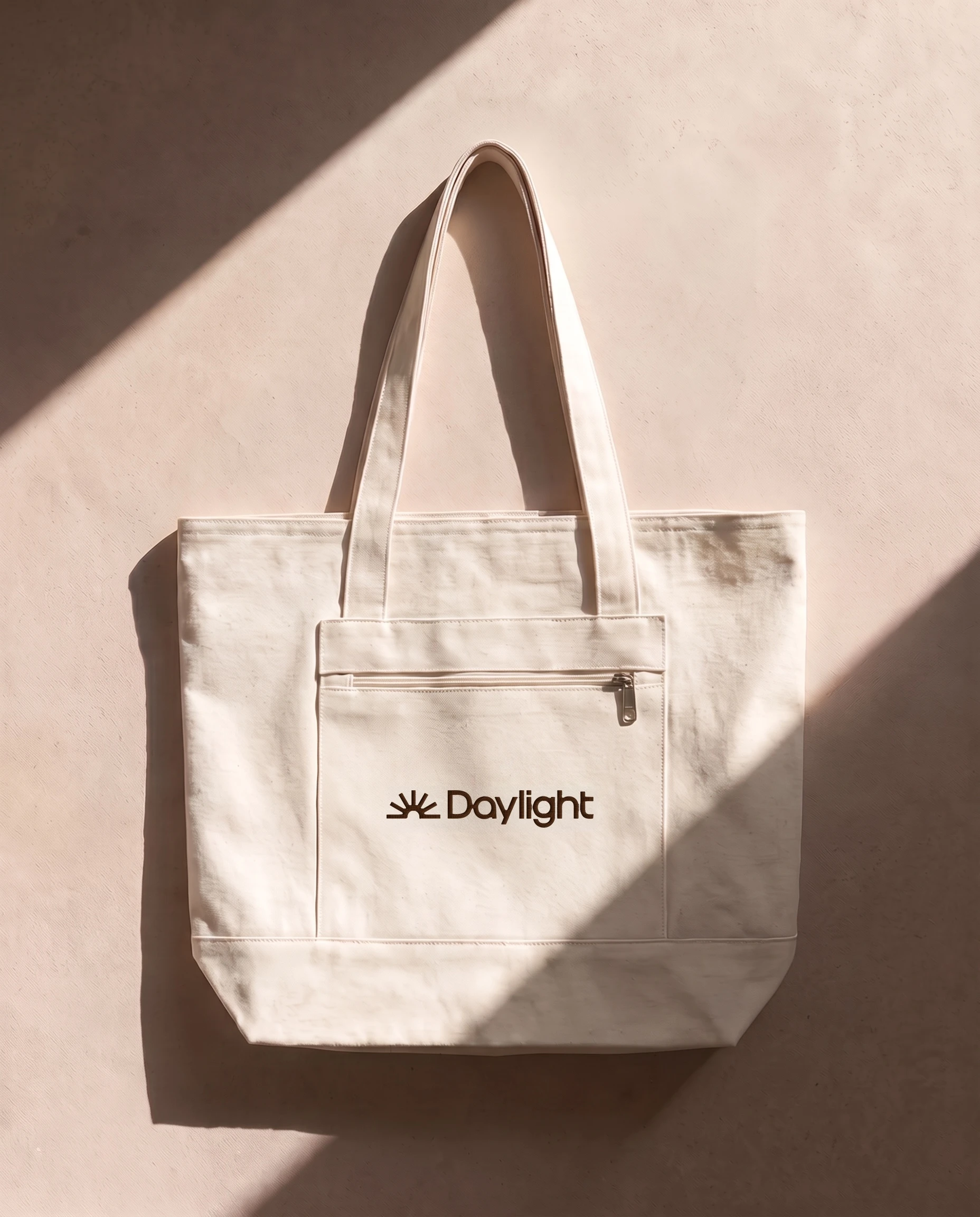 Cream canvas Daylight tote hanging on a wall
